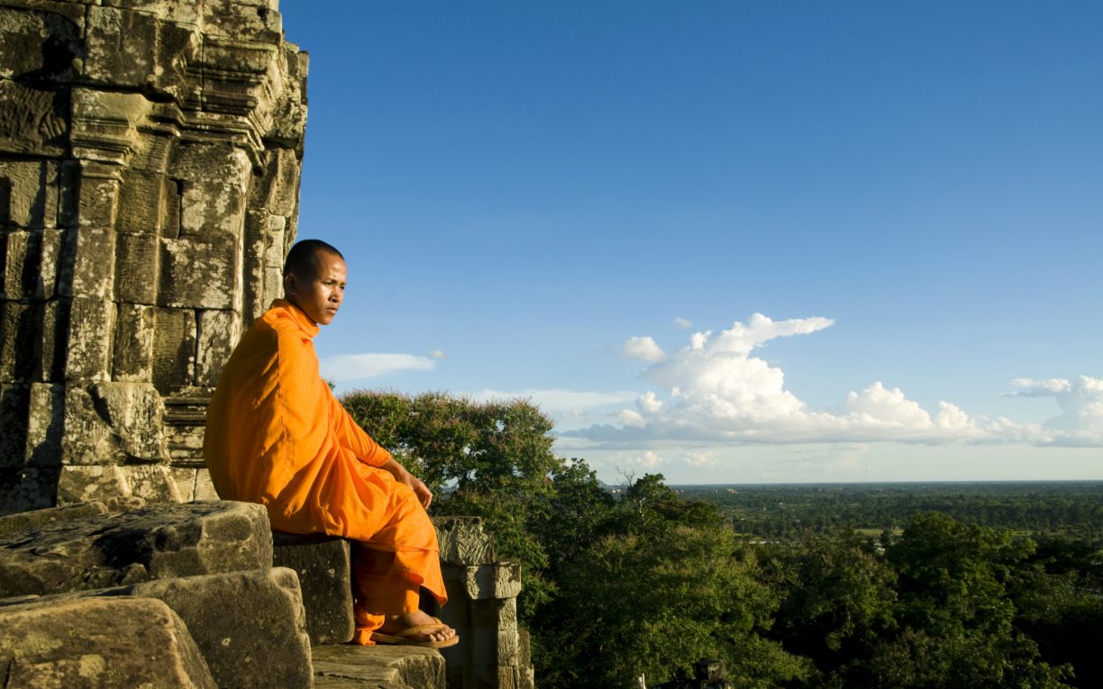 monk by temple siem reap cambodia